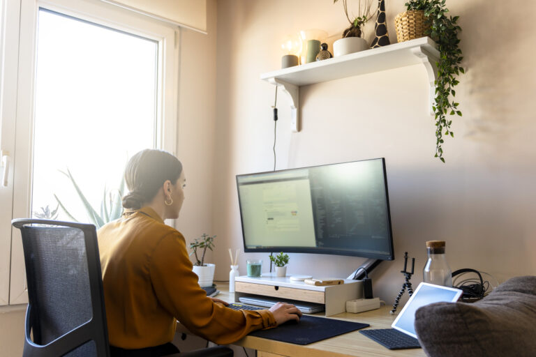 Computer programmer working from home. Teleworking concept.